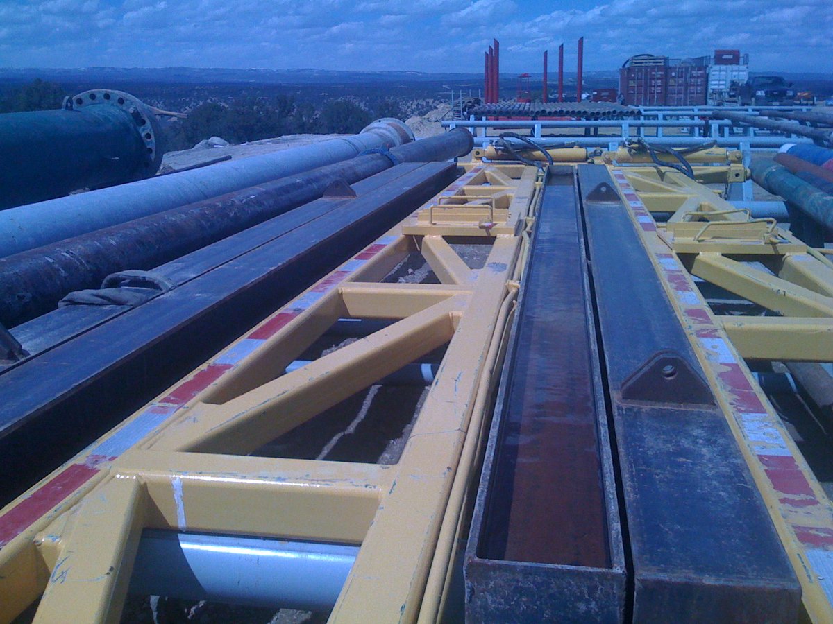 Fabricated oilfield steel frames and pipe in the yard